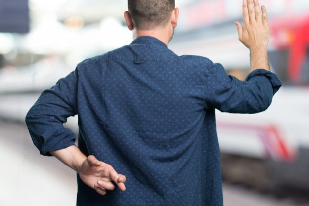 young-man-wearing-a-blue-outfit-cheating_1298-447